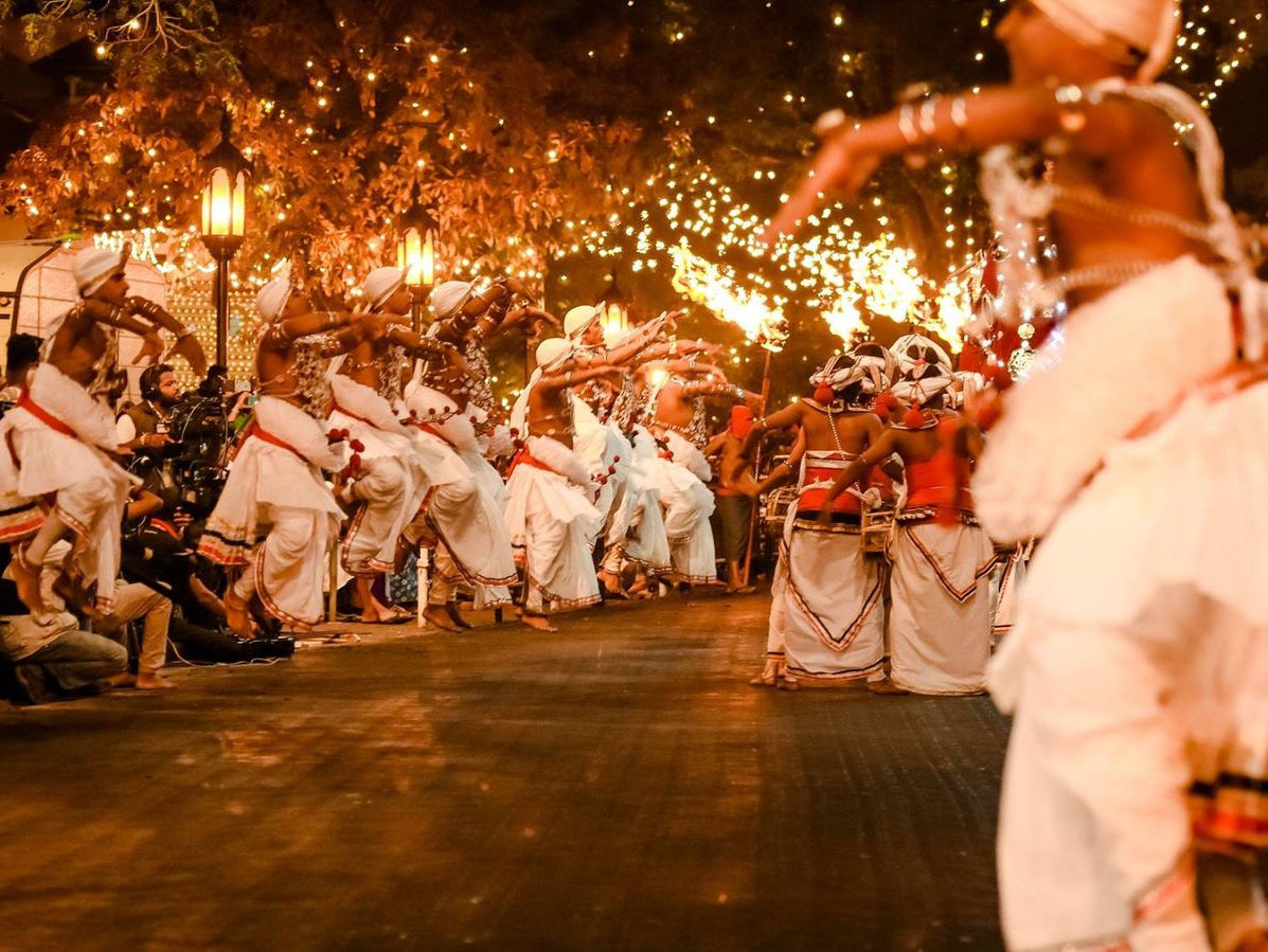 Fire dancers performing at the Esala Perahera procession in Kandy